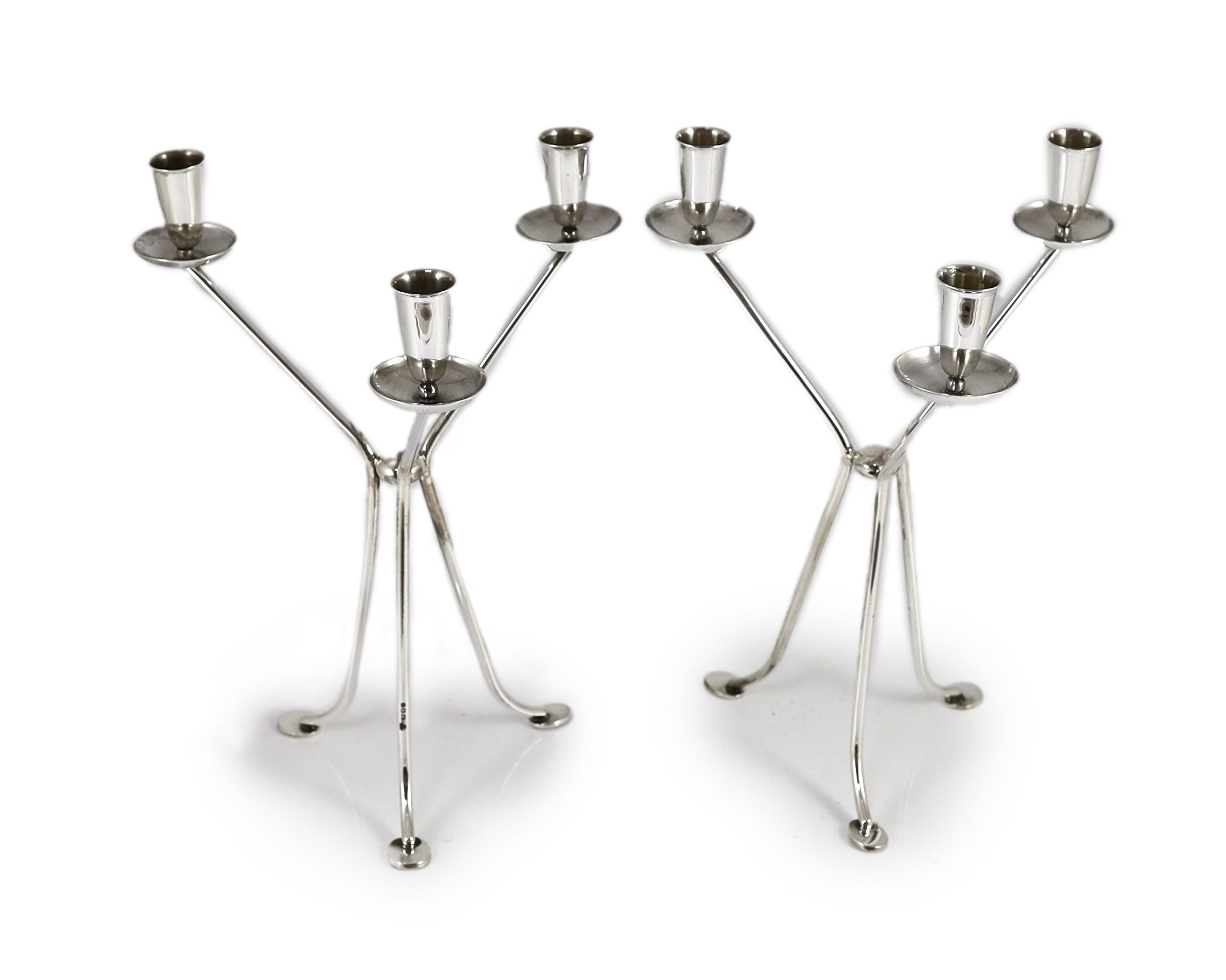 A modern pair of stylish three branch, three light candelabra by Harrods Ltd